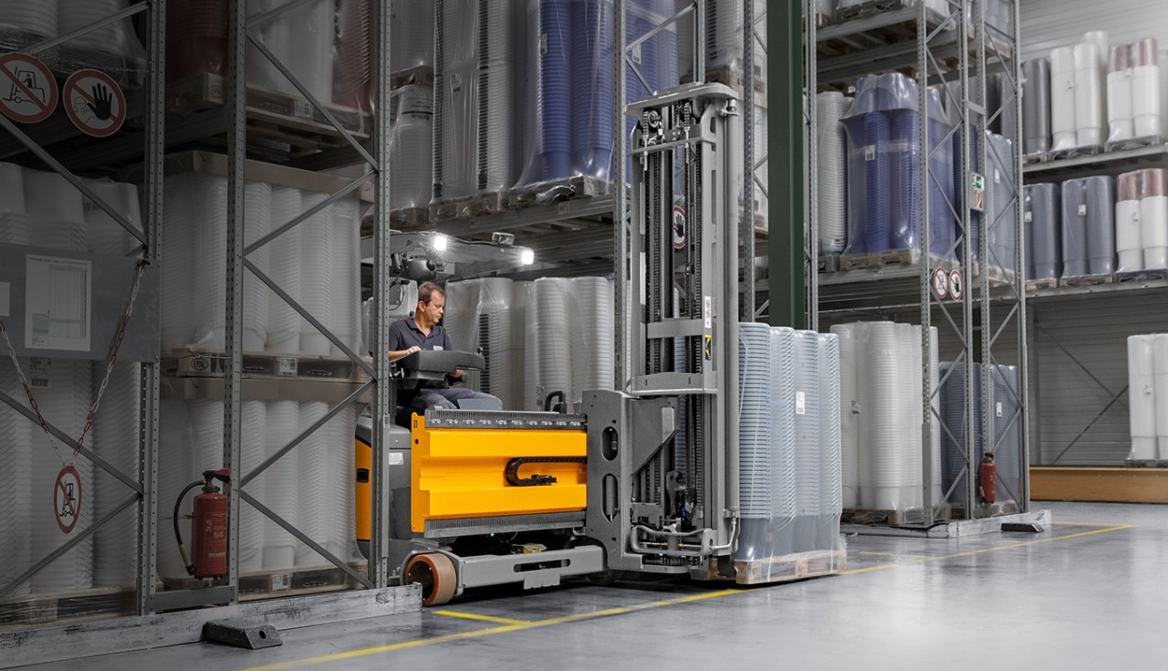 Jungheinrich turret truck in warehouse aisle