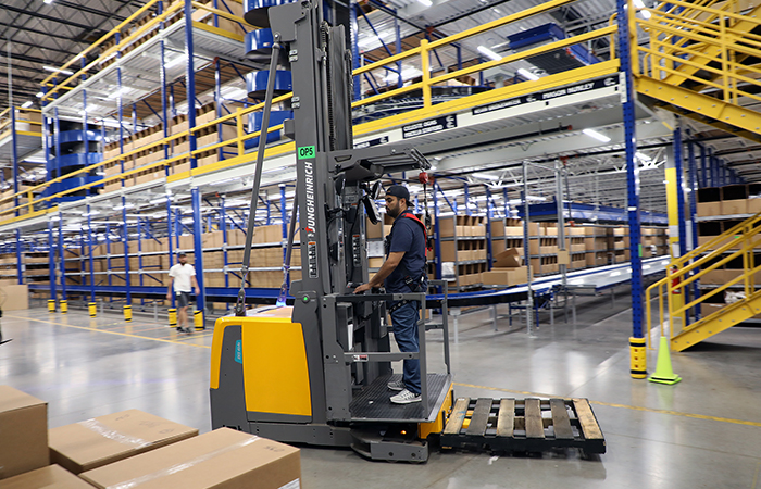 Jungheinrich narrow aisle forklift in Cowboys' warehouse