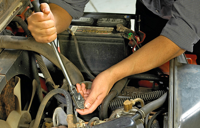 Service technician working on a forklift