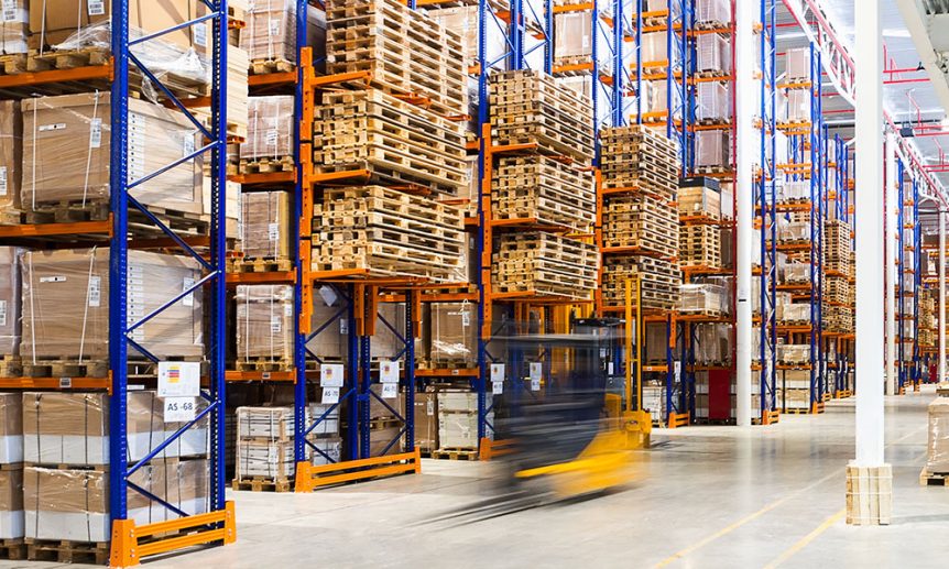 Forklift moving quickly through a warehouse