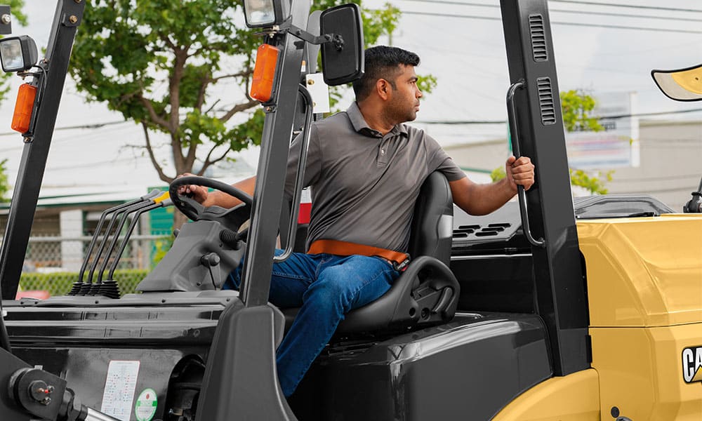 Man driving a CAT Forklift