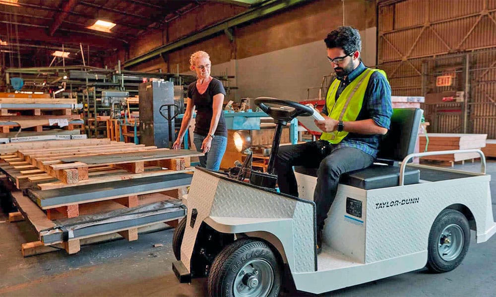 White Taylor Dunn Utility Vehicle in Warehouse