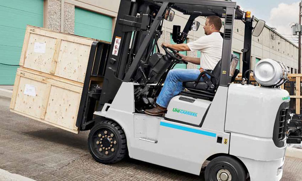 Unicarrier forklift going up a ramp outside of warehouse