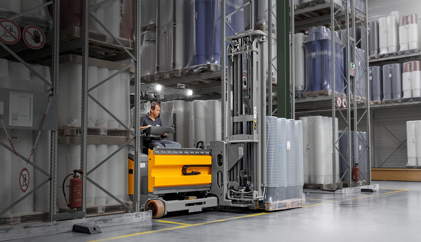 Jungheinrich Turret truck in warehouse aisle