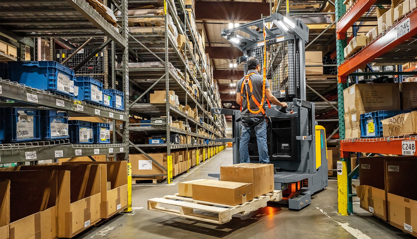 Jungheinrich narrow aisle forklift in warehouse aisle